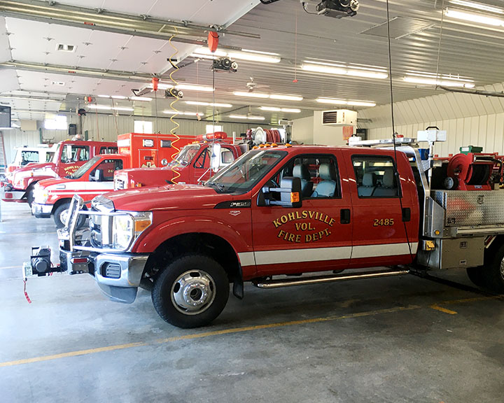 Fire Trucks Parked Inside Post-Frame Fire Station