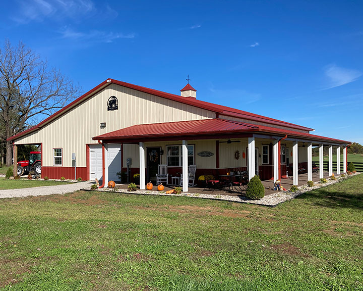 Barndominium With Red Colored Roof and Beige Siding