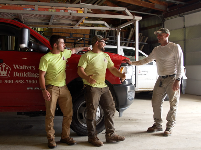 Walters Crew Members Talking Next to a Company Truck
