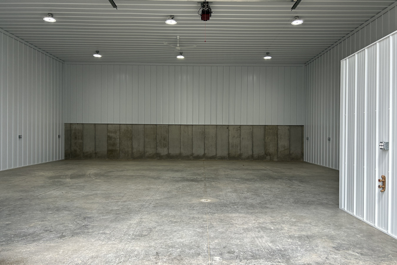 Each unit includes insulated steel interiors, bright LED lighting, and a poured concrete wall to support the hillside grade.