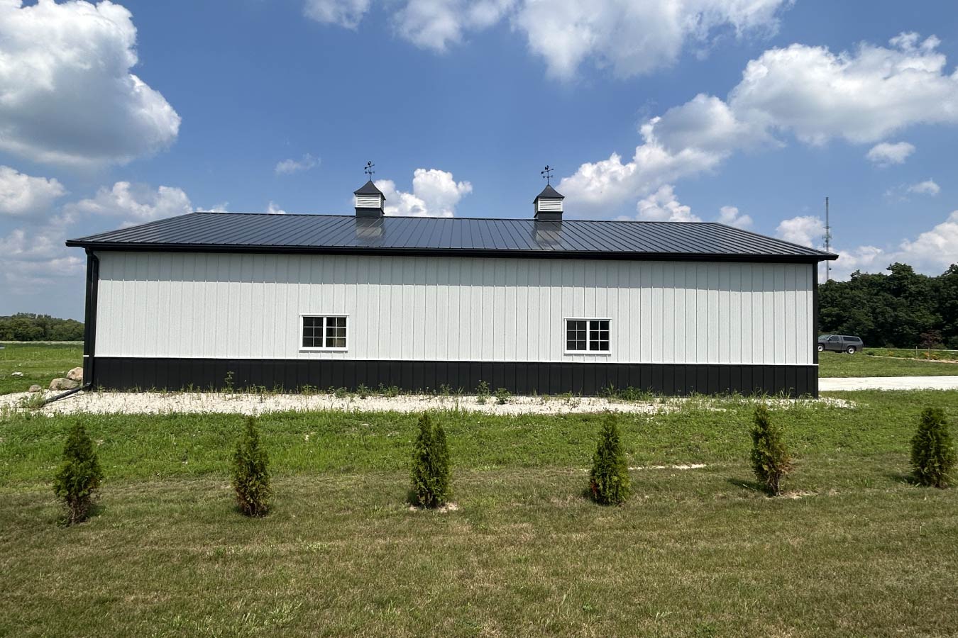 A clean side elevation framed by new plantings.